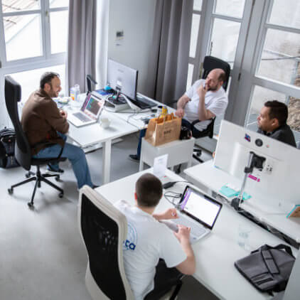 Kinsta team working in the Kinsta office